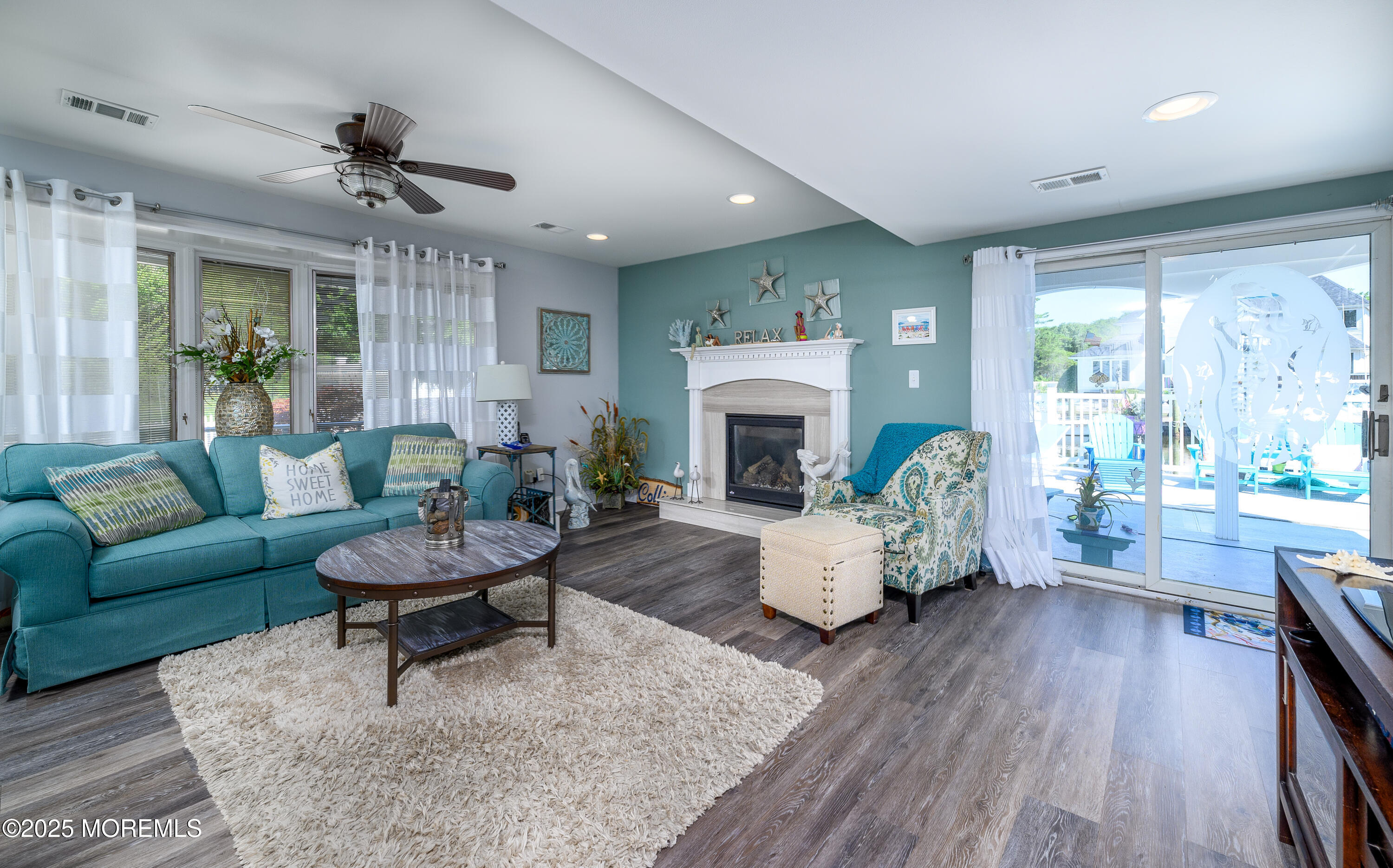 109 West Island Road Bayville, NJ 08721 - Photo 17 of 38 a living room with furniture fireplace and a large window