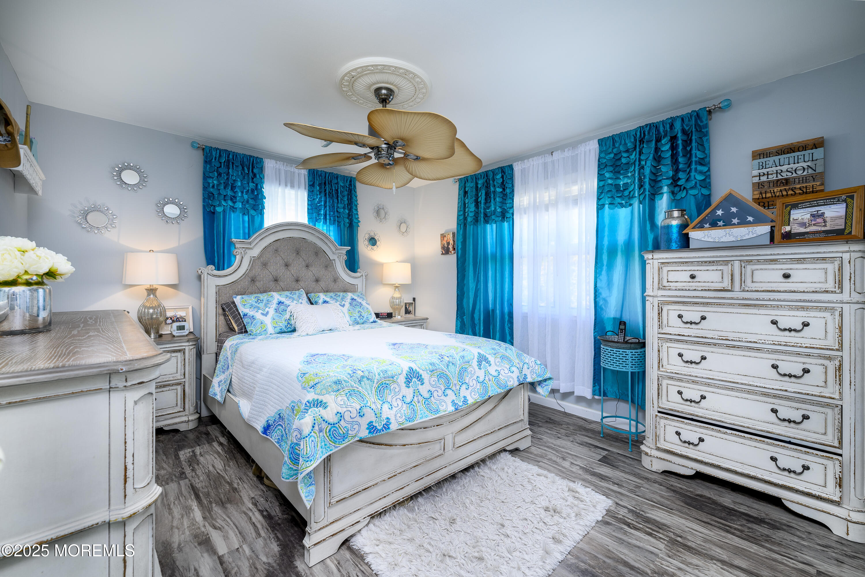 109 West Island Road Bayville, NJ 08721 - Photo 20 of 38 a bedroom with a bed a dresser and potted plants
