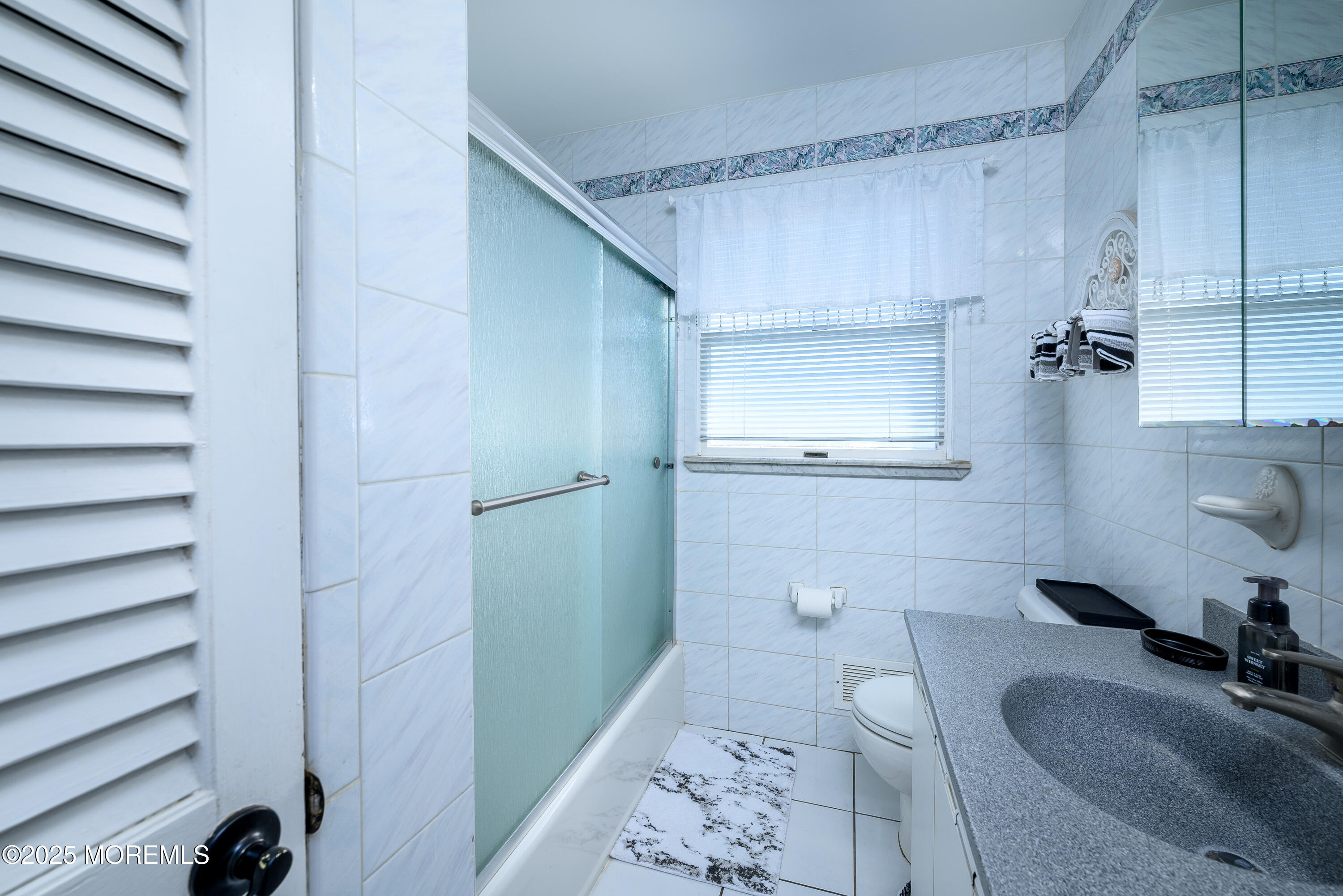 109 West Island Road Bayville, NJ 08721 - Photo 21 of 38 a bathroom with a sink and a mirror