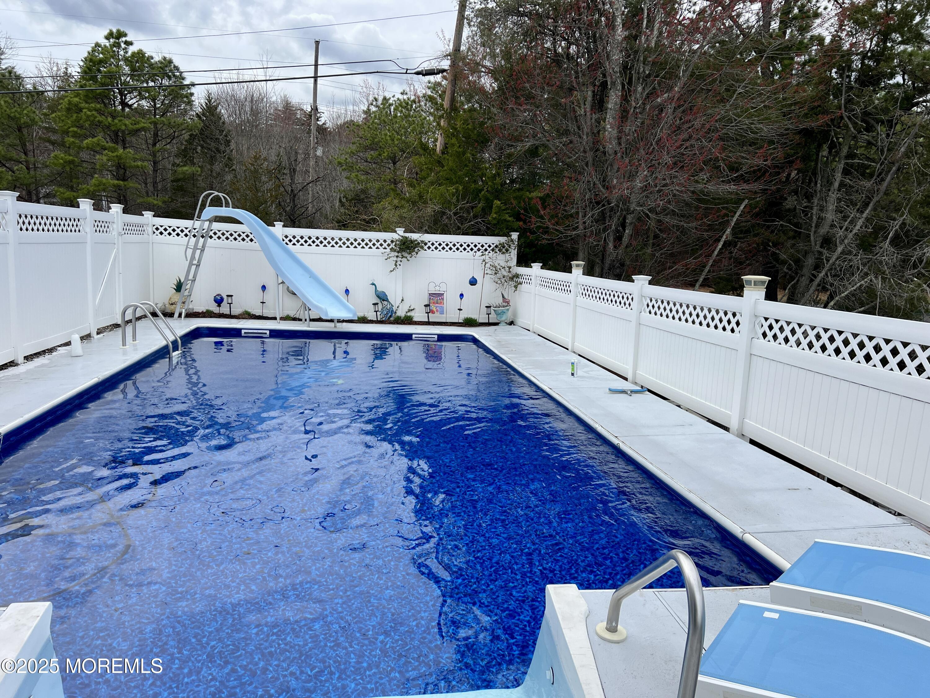 109 West Island Road Bayville, NJ 08721 - Photo 25 of 38 a view of a back yard with swimming pool