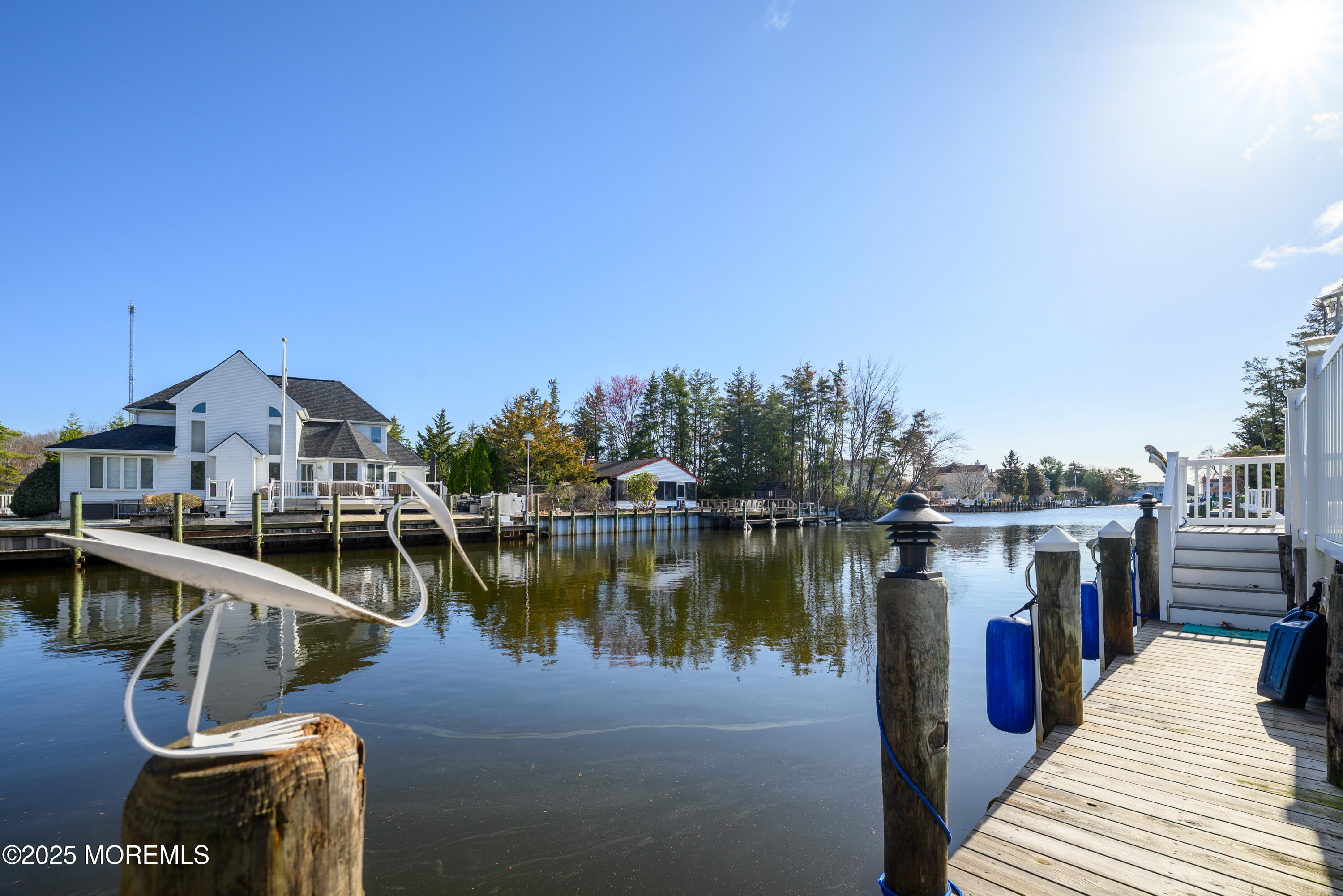 109 West Island Road Bayville, NJ 08721 - Photo 3 of 38 a view of a lake with a deck and a lake view