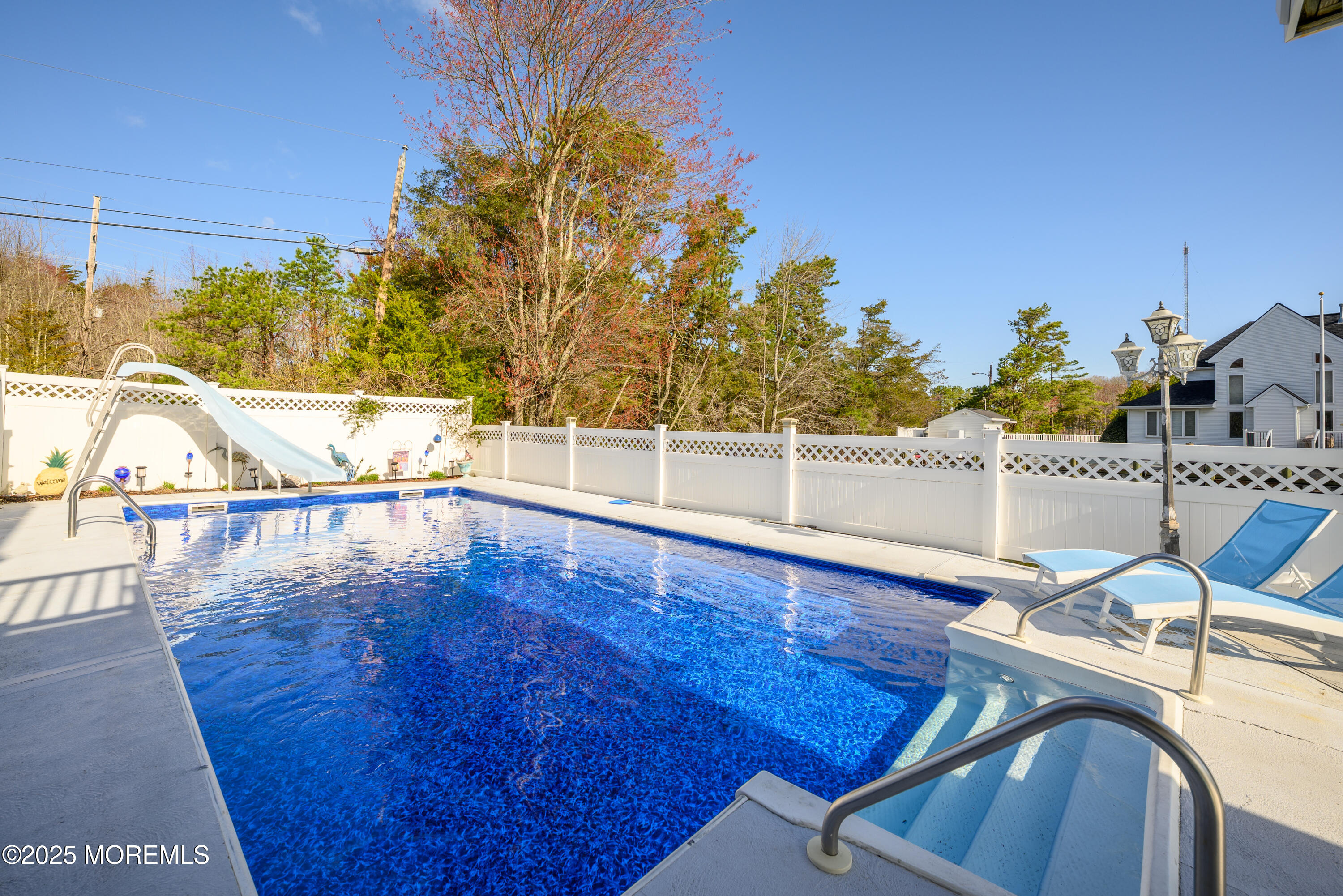 109 West Island Road Bayville, NJ 08721 - Photo 31 of 38 a view of a swimming pool with an outdoor seating