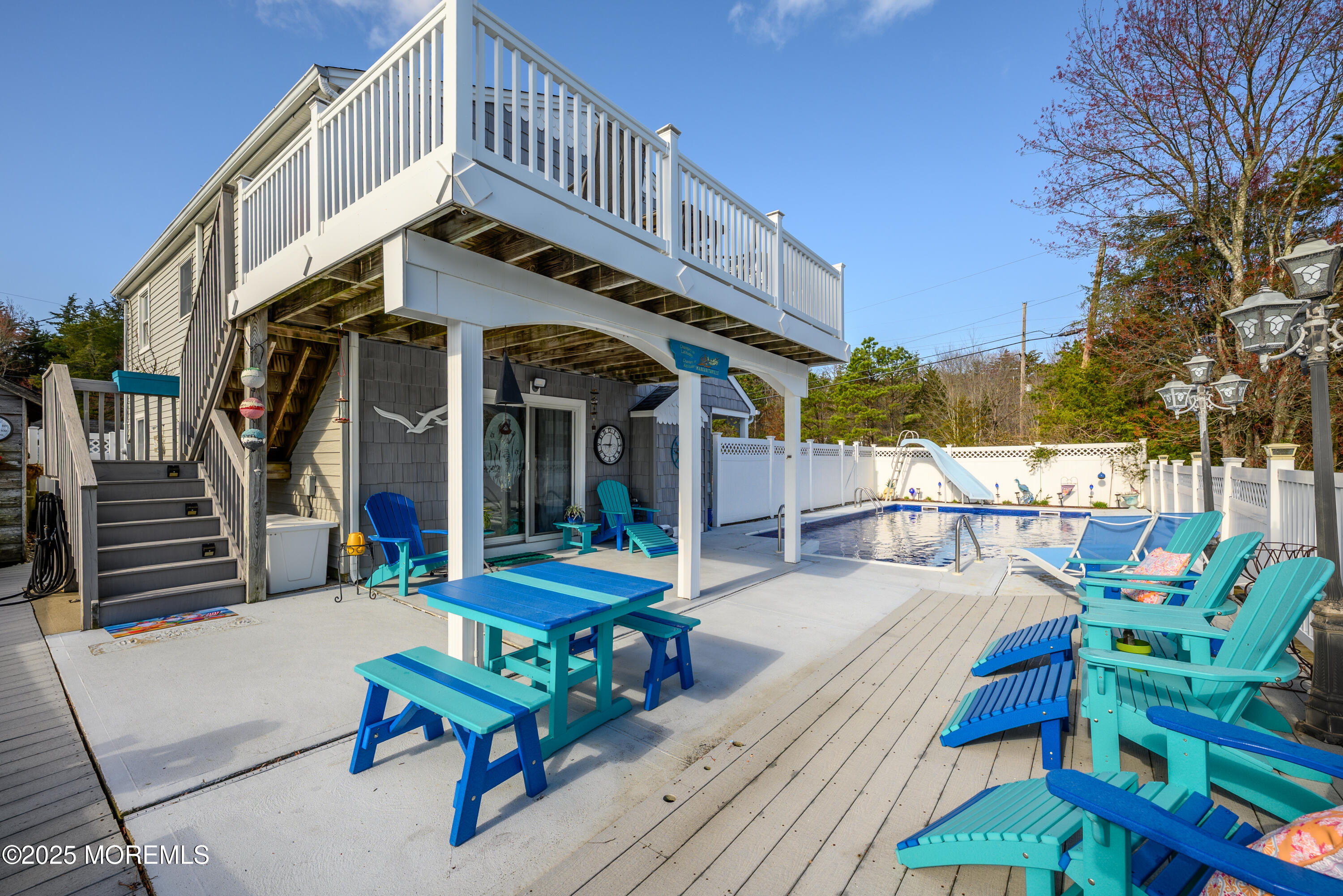 109 West Island Road Bayville, NJ 08721 - Photo 32 of 38 a view of a chair and tables in the balcony