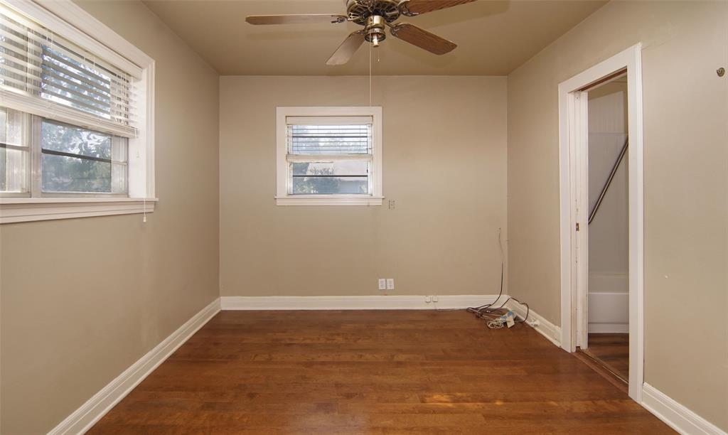 730 Indiana Street Graham, TX 76450 - Photo 17 of 25 a view of a room with a ceiling fan and a window