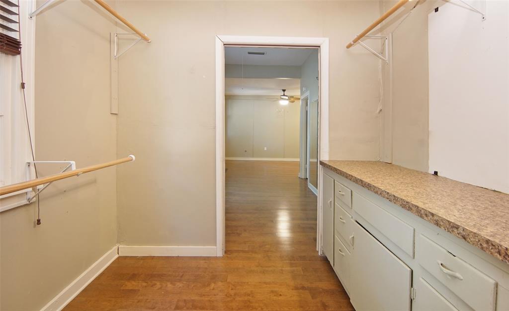 730 Indiana Street Graham, TX 76450 - Photo 21 of 25 a bathroom with a granite countertop sink and a mirror