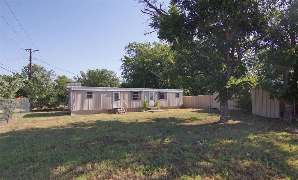 730 Indiana Street Graham, TX 76450 - Photo 25 of 25 a big room with yard and a large tree