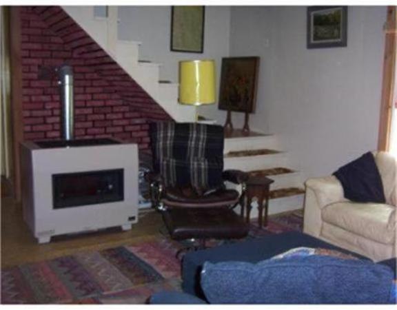 10 Hillside Road Peru, MA 01235 - Photo 4 of 8 a living room with furniture and a fireplace