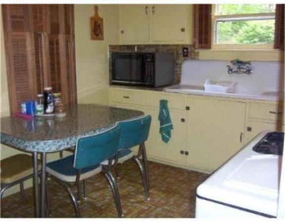 10 Hillside Road Peru, MA 01235 - Photo 5 of 8 a kitchen with a stove a sink and a microwave