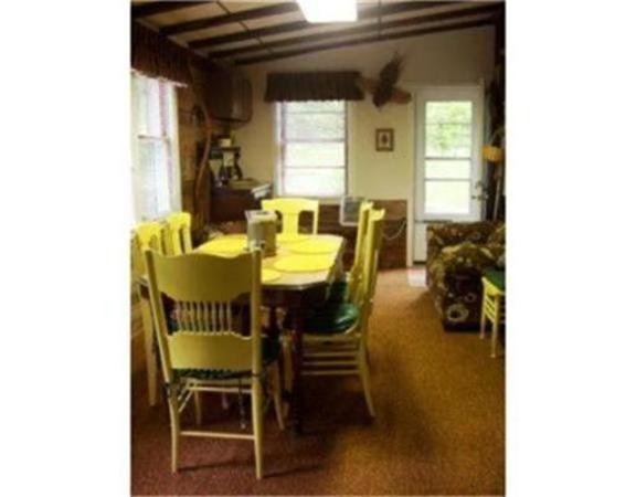 10 Hillside Road Peru, MA 01235 - Photo 6 of 8 a view of a dining room with furniture and a window