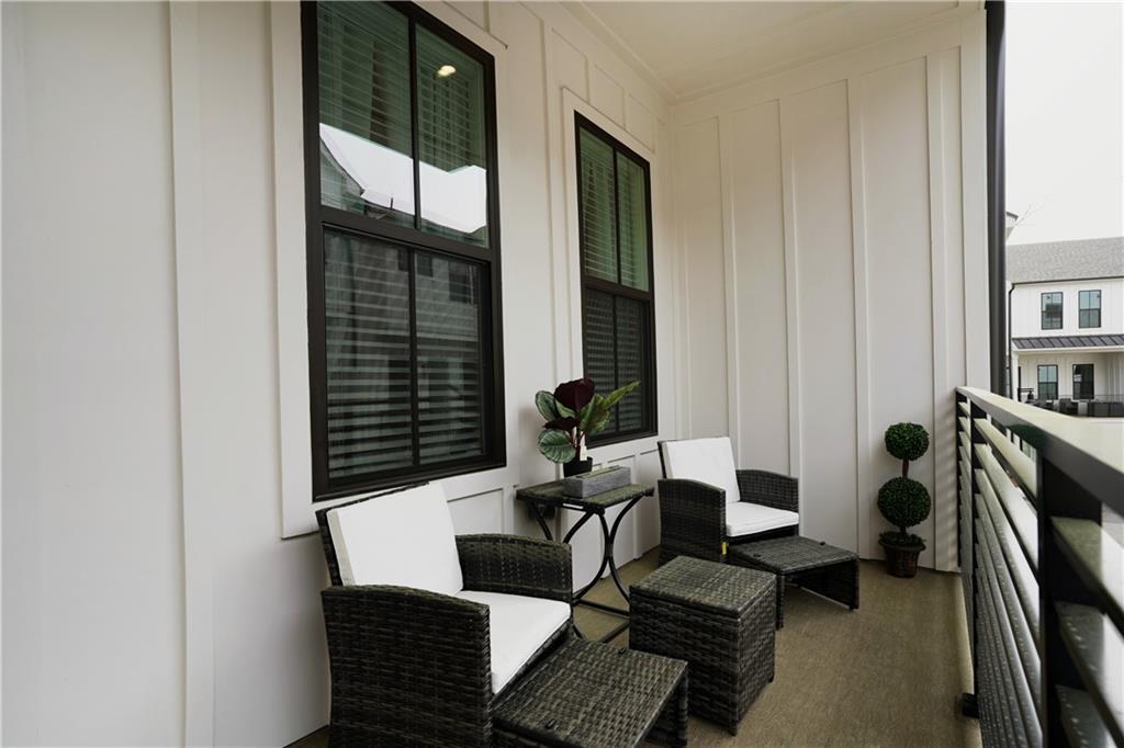 154 Chestnut Circle, Unit 80 Atlanta, GA 30342 - Photo 17 of 31 a living room with furniture a window and a flat screen tv