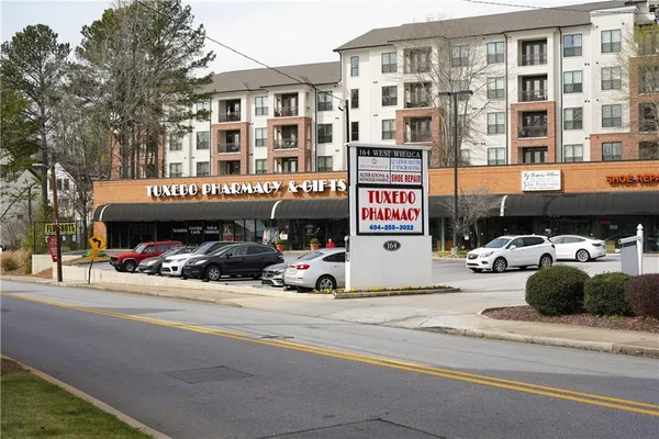a view of a street that has couple of cars parked on the road