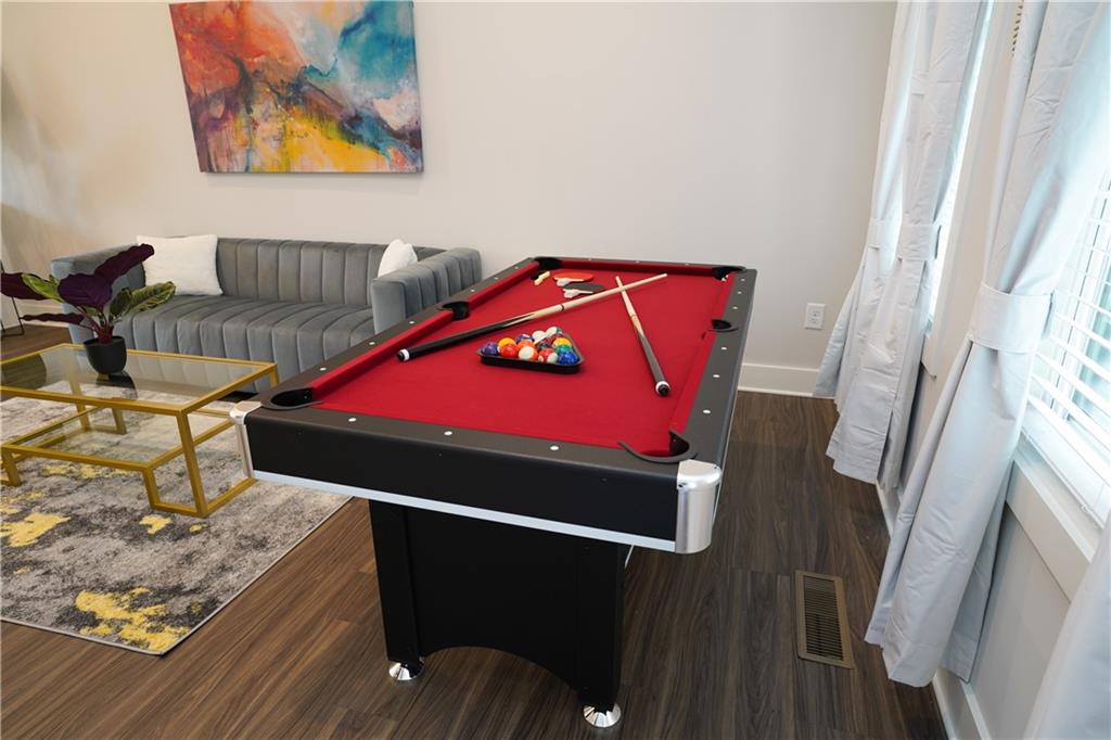 154 Chestnut Circle, Unit 80 Atlanta, GA 30342 - Photo 6 of 31 a bedroom with furniture and a couch