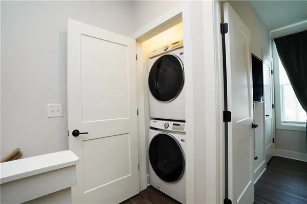 a view of a hallway with washer and dryer