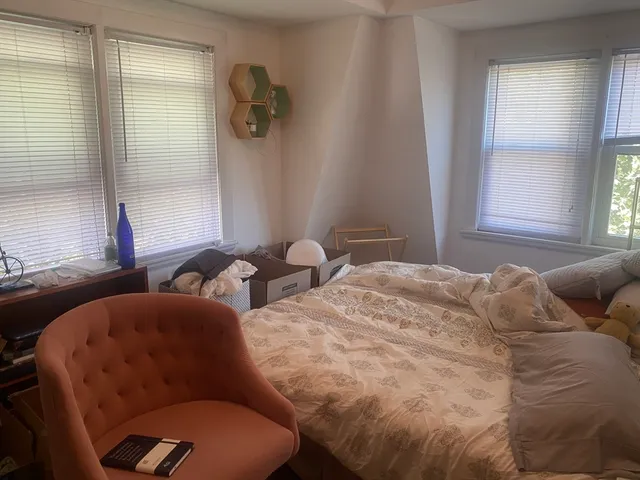 a living room with furniture and windows