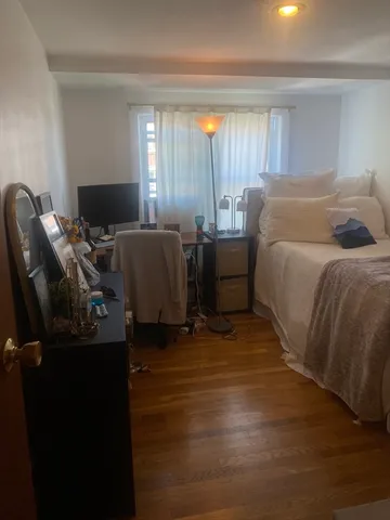 a bed room with a bed furniture and a window