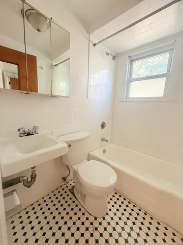 a bathroom with a sink toilet a shower and bathtub
