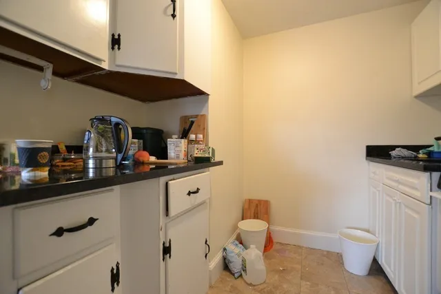 a bathroom with a sink a toilet and vanity