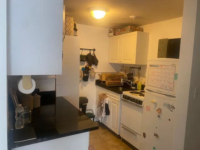 a view of a kitchen with appliances and cabinets