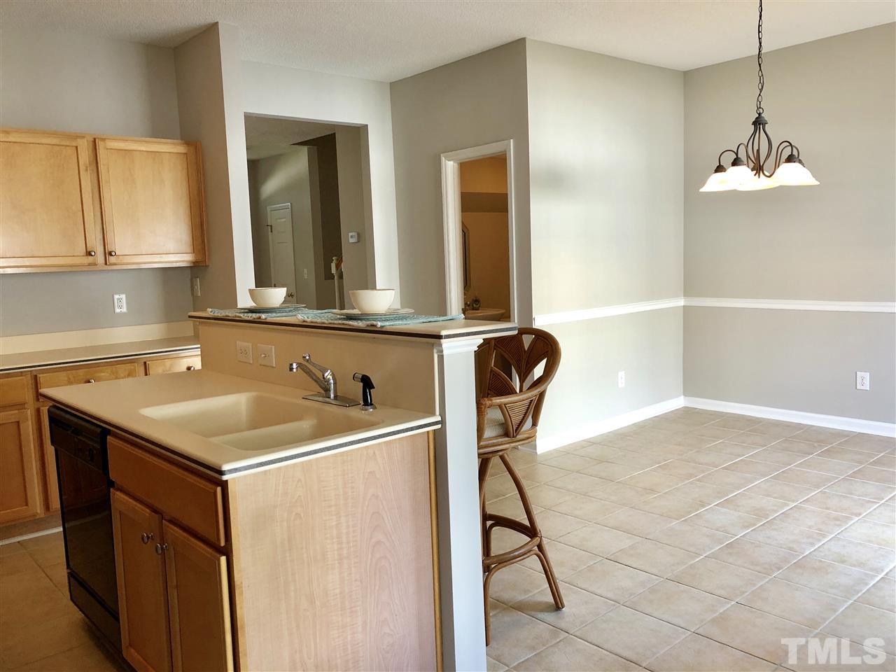 12542 Spruce Tree Way Raleigh, NC 27614 - Photo 7 of 25 Island seating plus large dining area. Dishwasher and disposal.