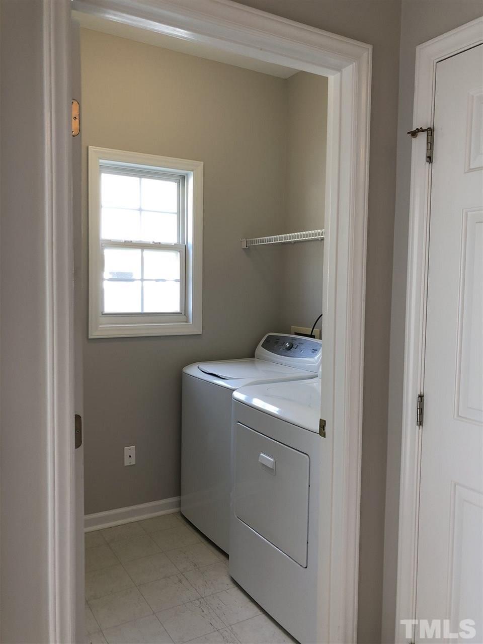 12542 Spruce Tree Way Raleigh, NC 27614 - Photo 9 of 25 Nice size utility room next to the pantry and outside door.
