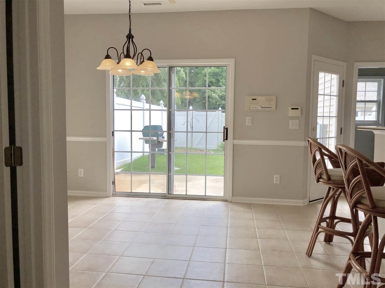12542 Spruce Tree Way Raleigh, NC 27614 - Photo 10 of 25 Sliding doors out from the dining room to the gas grill and back yard