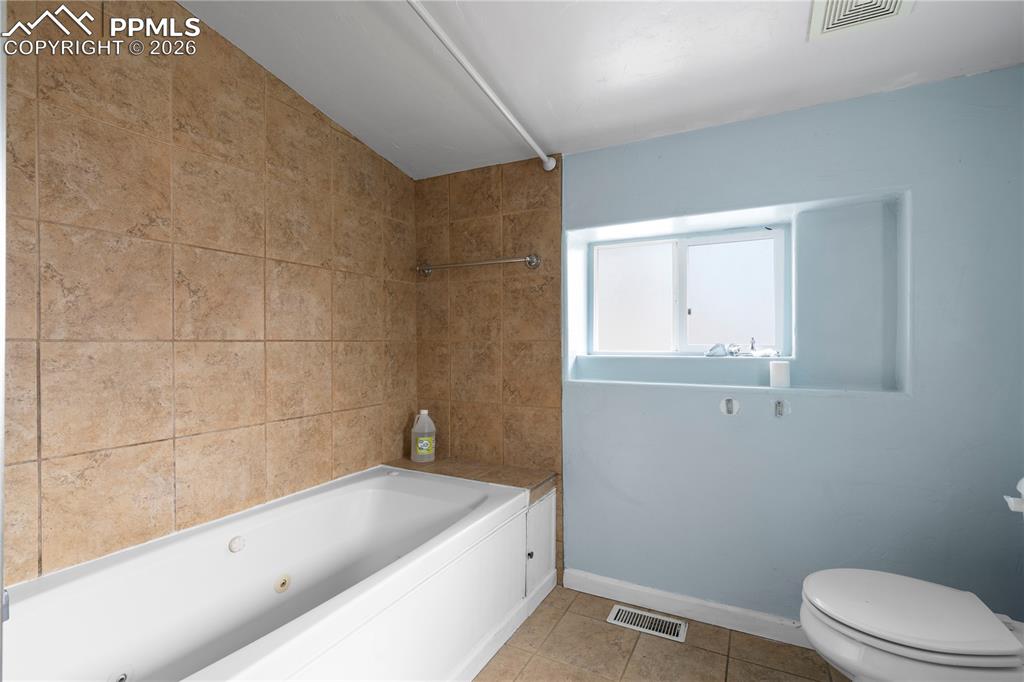 2232 East Routt Avenue Pueblo, CO 81004 - Photo 14 of 21 a bathroom with a bathtub and sink