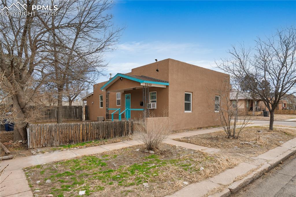 2232 East Routt Avenue Pueblo, CO 81004 - Photo 19 of 21 a front view of a house with a yard