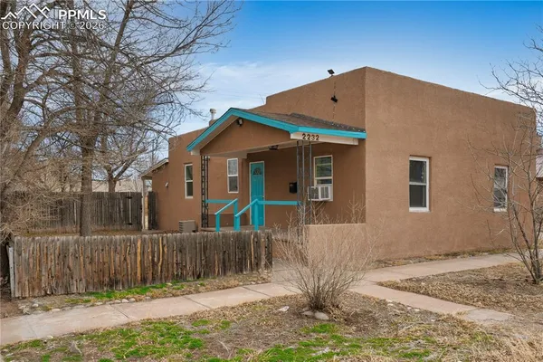 a front view of house with a yard