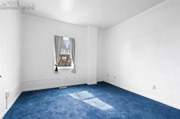 an empty room with window