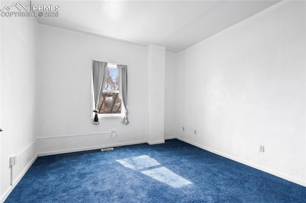 2232 East Routt Avenue Pueblo, CO 81004 - Photo 10 of 21 an empty room with window