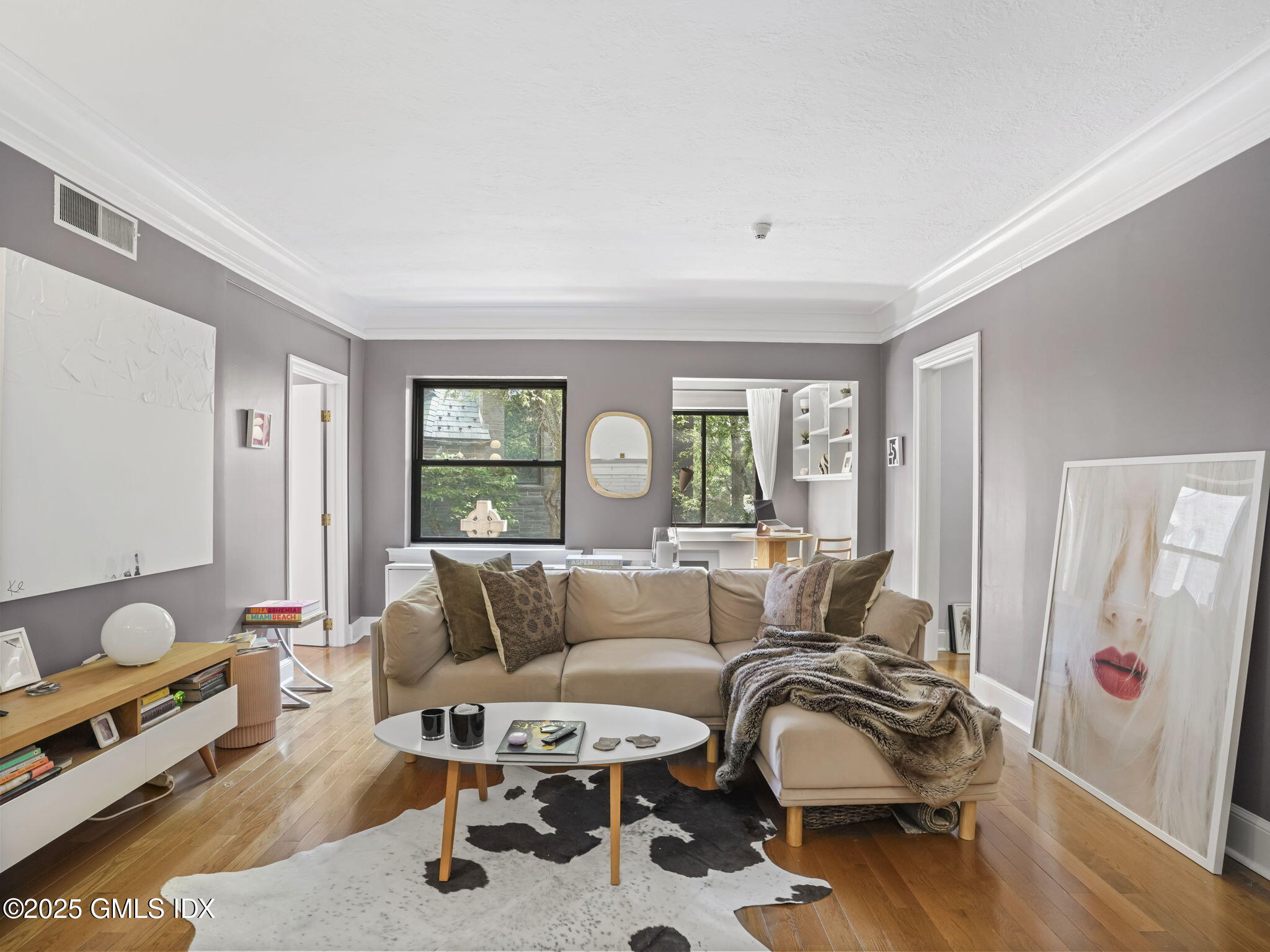 4 Lafayette Court, Unit 1C Greenwich, CT 06830 - Photo 2 of 17 a living room with furniture and wooden floor