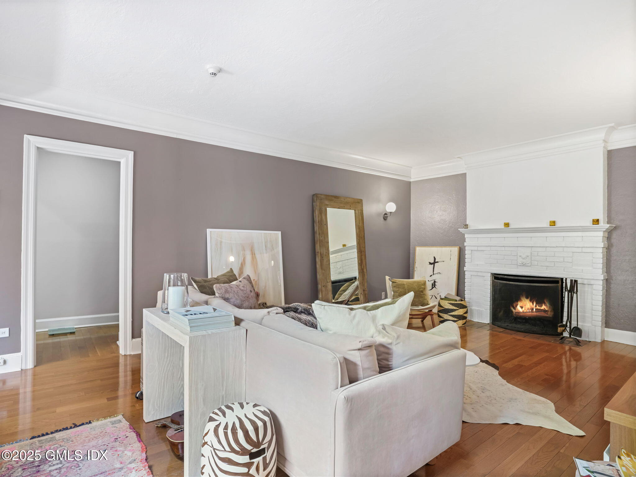 4 Lafayette Court, Unit 1C Greenwich, CT 06830 - Photo 3 of 17 a living room with furniture and a fireplace