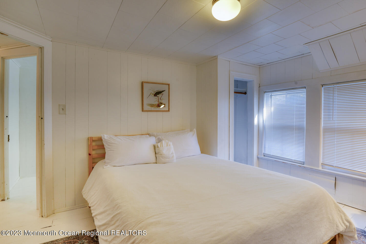 13 Pilgrim Pathway Ocean Grove, NJ 07756 - Photo 11 of 19 a bedroom with a bed and a lamp