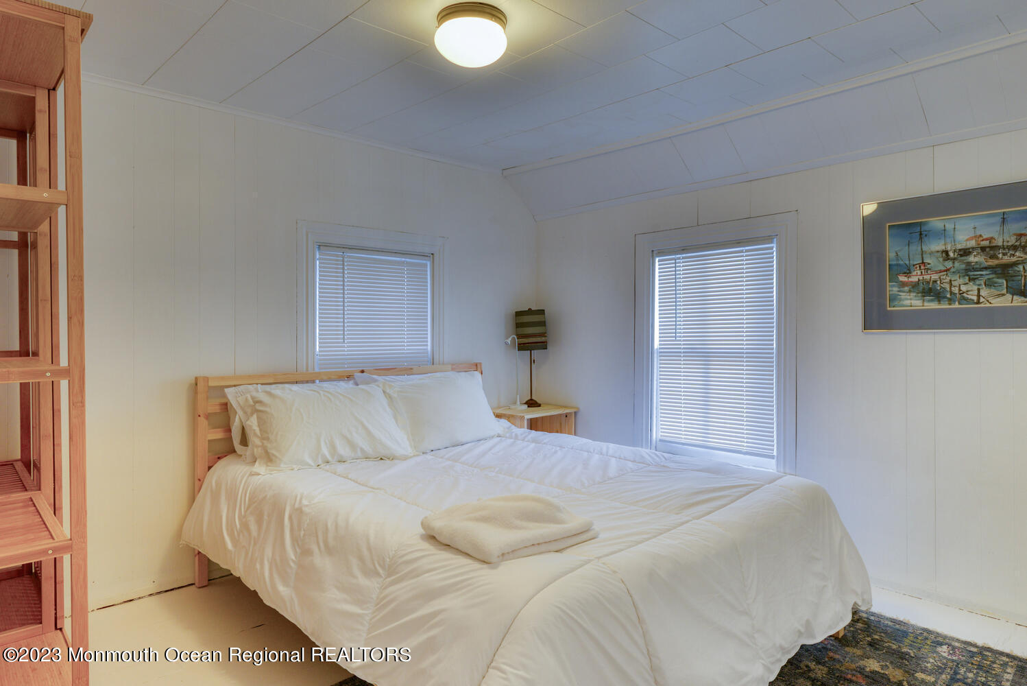 13 Pilgrim Pathway Ocean Grove, NJ 07756 - Photo 13 of 19 a bedroom with a bed and painting on the wall