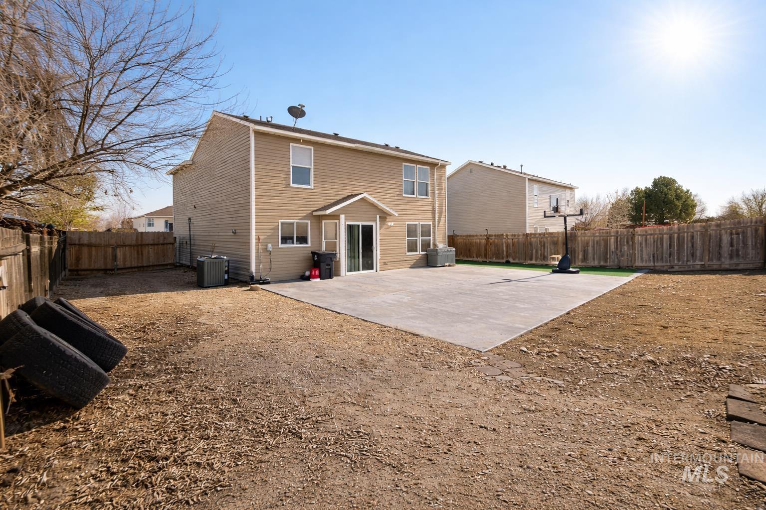 14057 Santa Cruz Street Caldwell, ID 83607 - Photo 26 of 26 Back of house featuring a patio and a fenced backyard