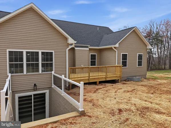 a view of a house with wooden fence