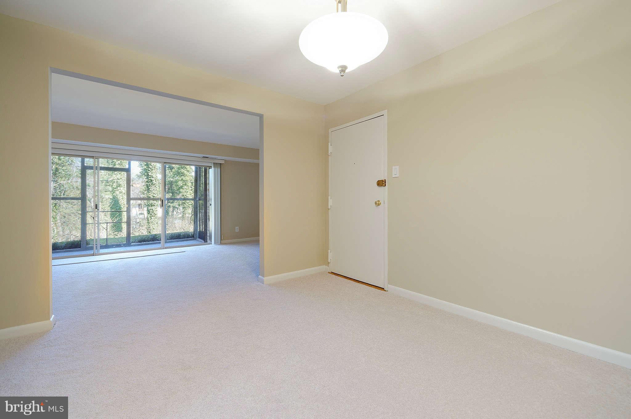 11601 Vantage Hill Road, Unit 1A Reston, VA 20190 - Photo 2 of 13 an empty room with windows