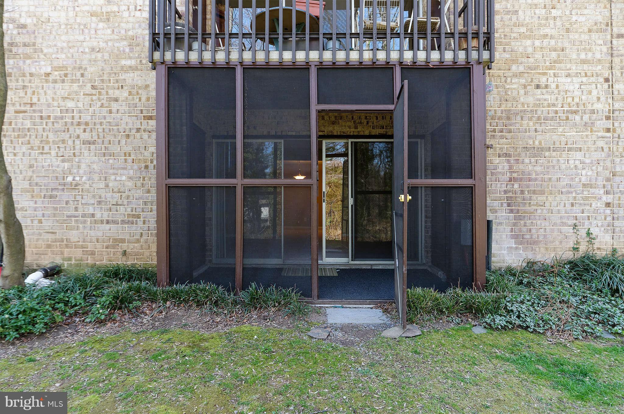11601 Vantage Hill Road, Unit 1A Reston, VA 20190 - Photo 13 of 13 a couple of potted plants in front of door