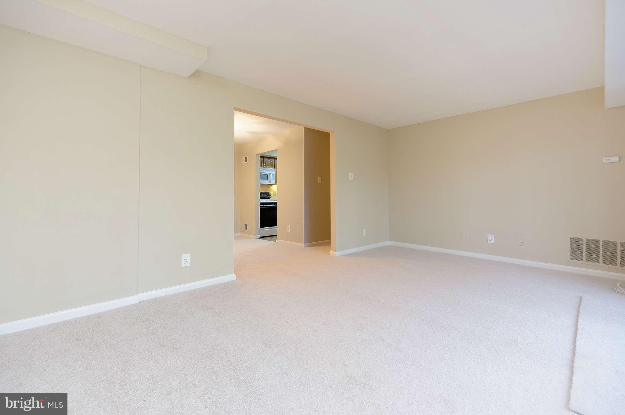 11601 Vantage Hill Road, Unit 1A Reston, VA 20190 - Photo 3 of 13 wooden floor in an empty room