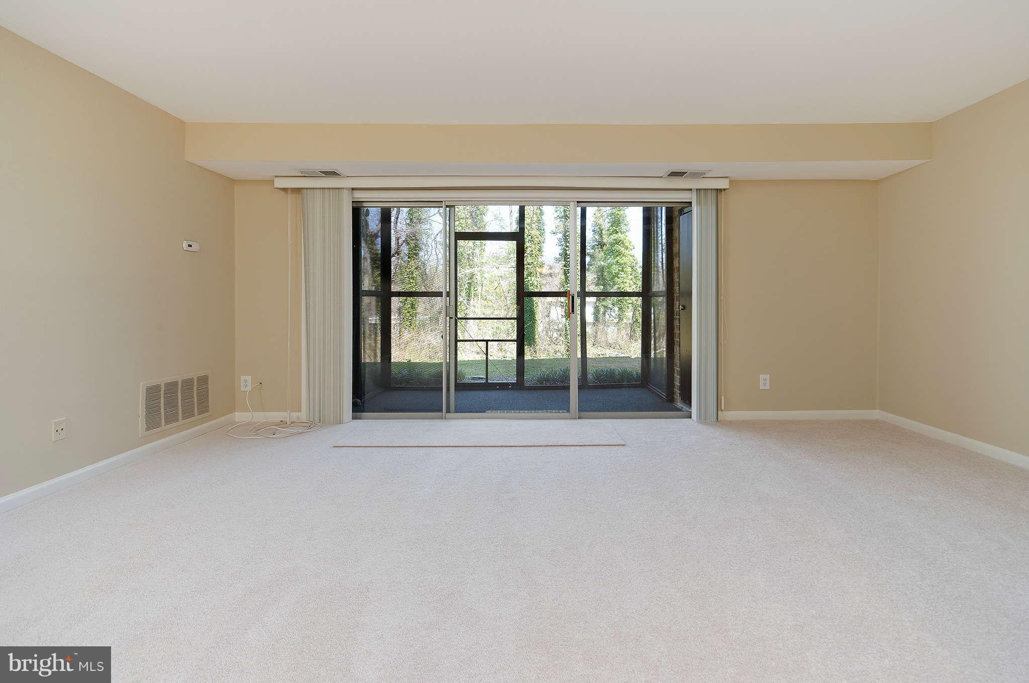 11601 Vantage Hill Road, Unit 1A Reston, VA 20190 - Photo 4 of 13 an empty room with window