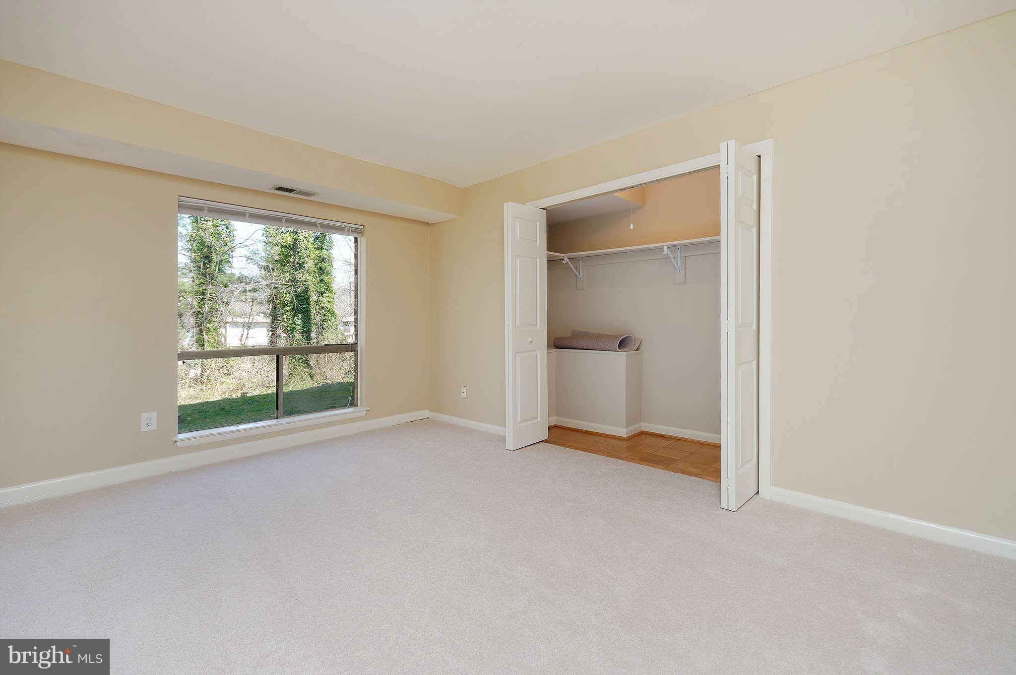 11601 Vantage Hill Road, Unit 1A Reston, VA 20190 - Photo 8 of 13 an empty room with windows and closet