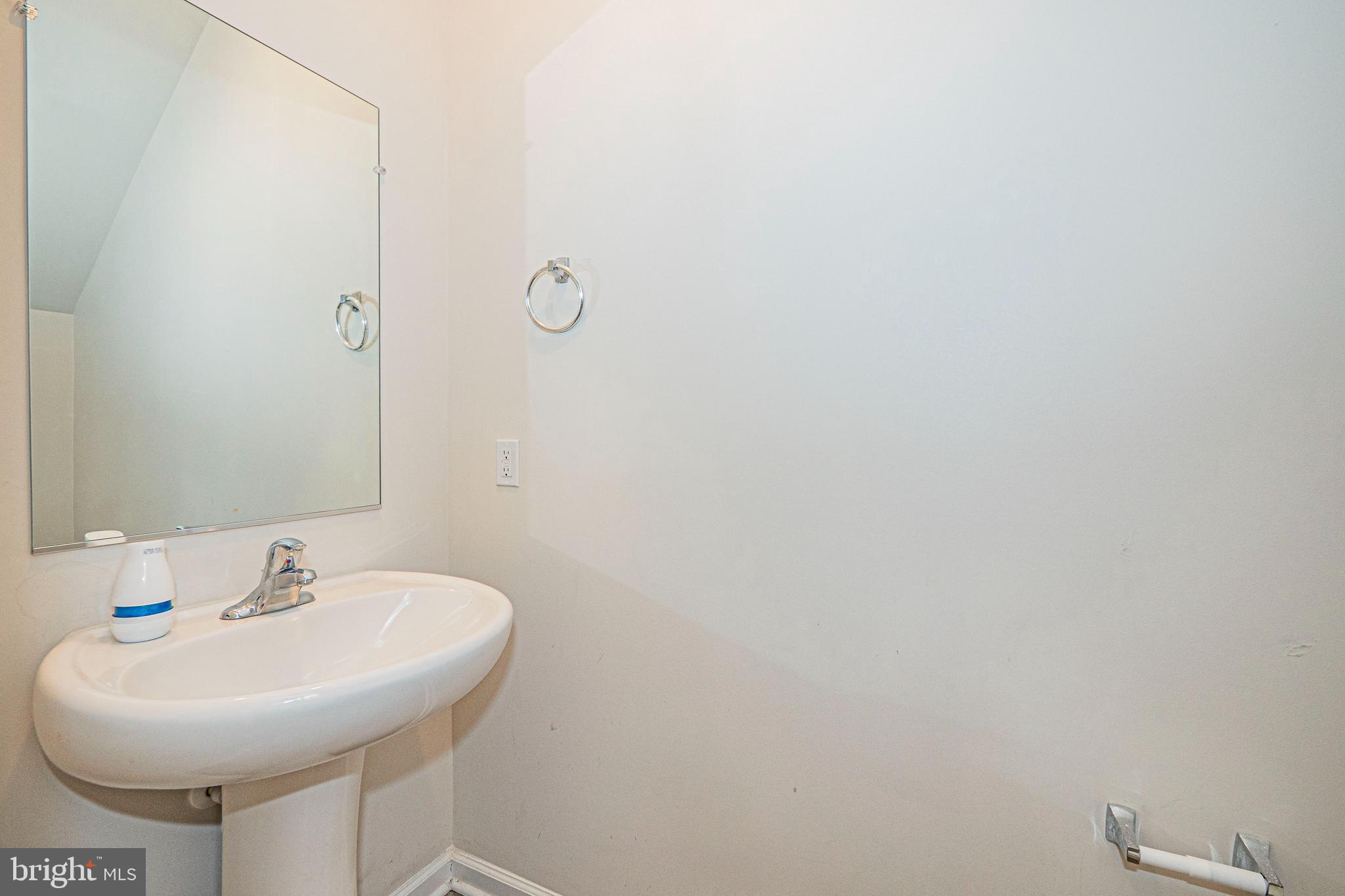 120 Paddington Street Falling Waters, WV 25419 - Photo 11 of 34 a bathroom with a sink and a mirror