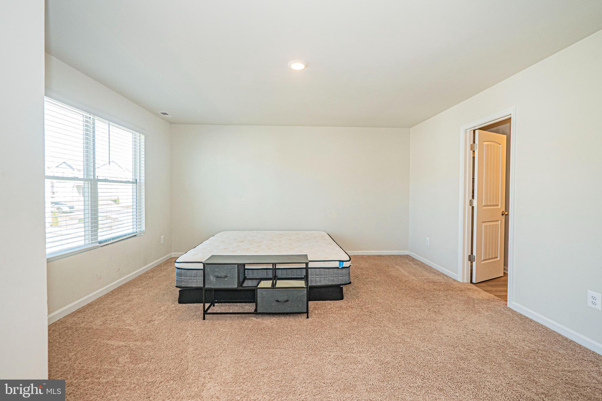 120 Paddington Street Falling Waters, WV 25419 - Photo 15 of 34 a room with a bed and window