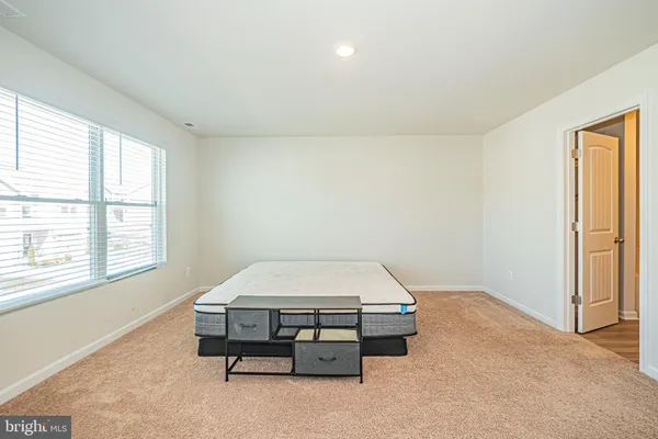 a bathroom with a granite countertop sink a toilet and bathtub