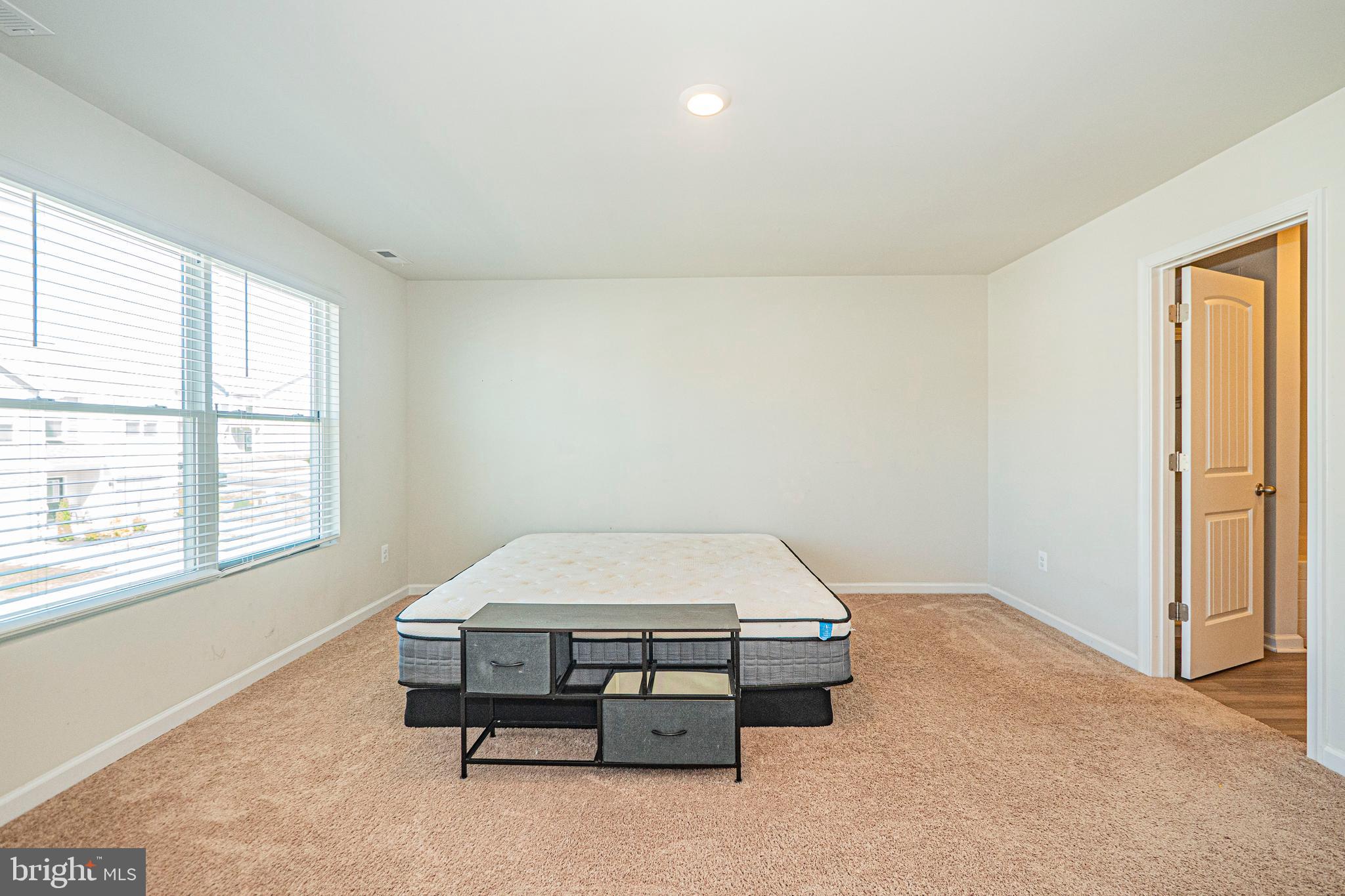 120 Paddington Street Falling Waters, WV 25419 - Photo 17 of 34 an empty room with windows and cabinet