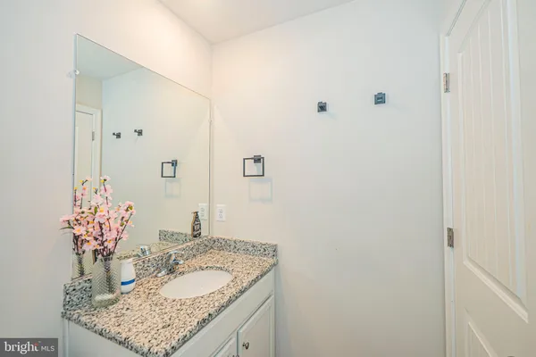 a view of a patio with a table and chairs