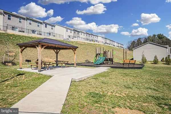 a view of a swimming pool with a yard