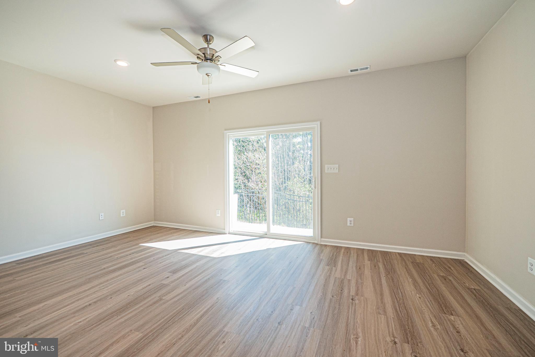 120 Paddington Street Falling Waters, WV 25419 - Photo 7 of 34 wooden floor in an empty room with a window
