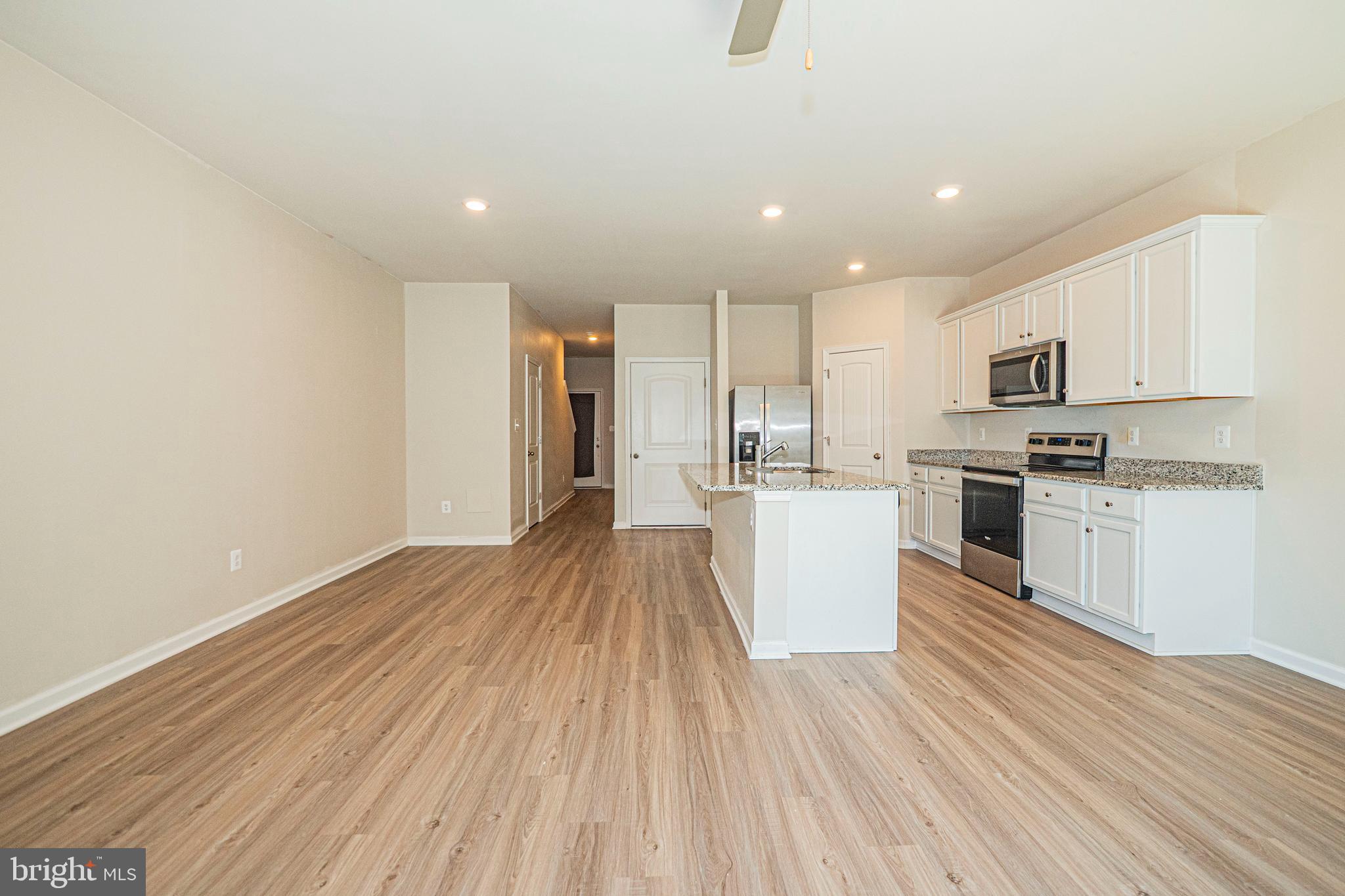120 Paddington Street Falling Waters, WV 25419 - Photo 10 of 34 a view of kitchen with cabinets microwave and stove