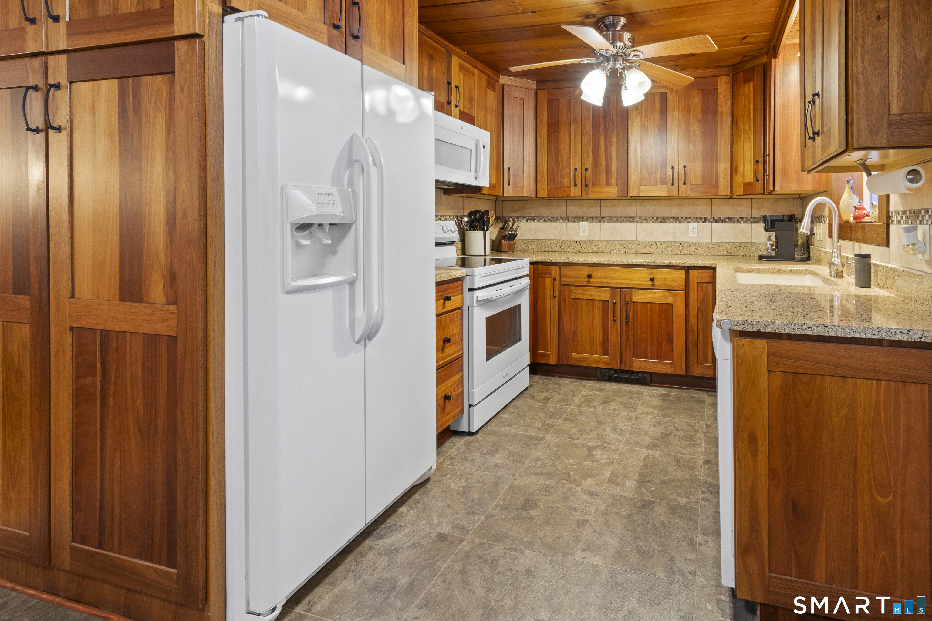 204 Paine Road Pomfret, CT 06259 - Photo 7 of 32 a kitchen with stainless steel appliances a refrigerator and a sink